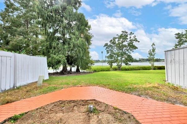 1502 NE Buckeye Rd NE Unit 2, Winter Haven, FL 33881 - view of yard featuring a water view and fence
