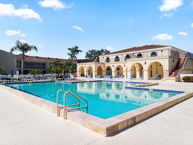 view of pool featuring a patio