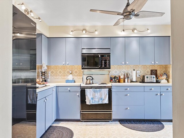 kitchen with backsplash, ceiling fan, range with electric stovetop, and blue cabinetry