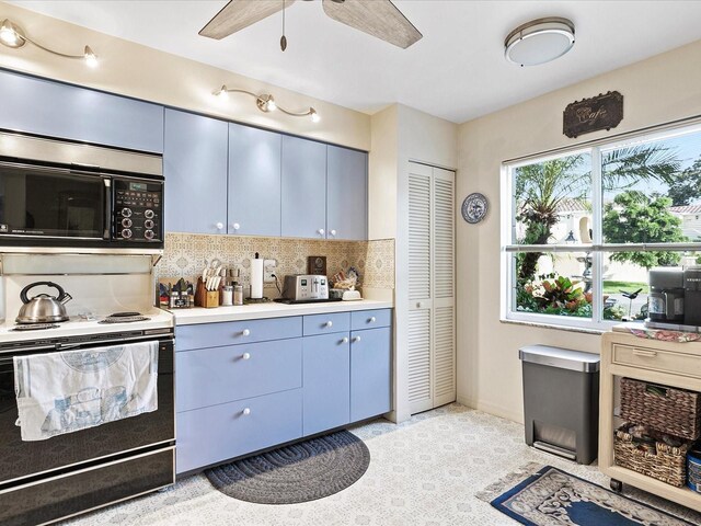 kitchen featuring ceiling fan, decorative backsplash, white range with electric stovetop, and blue cabinetry