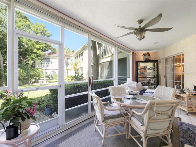 sunroom / solarium with ceiling fan