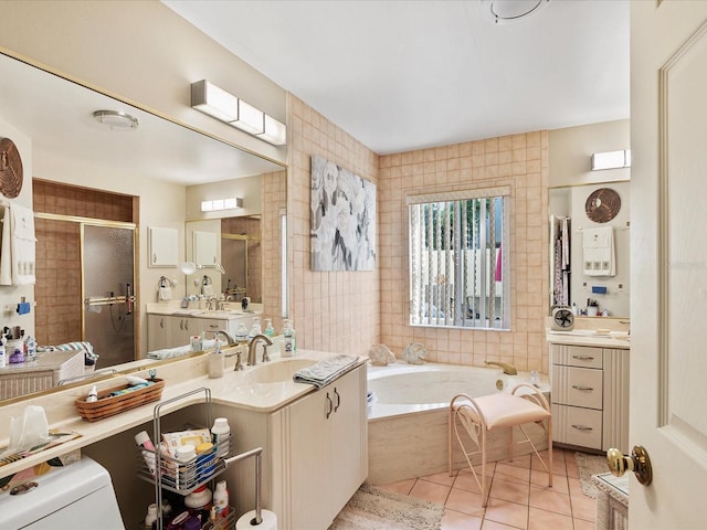 bathroom with plus walk in shower, vanity, and tile patterned floors