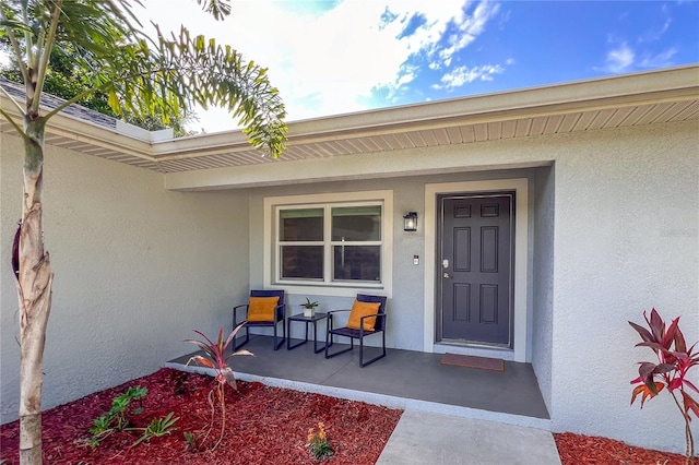 doorway to property with a porch