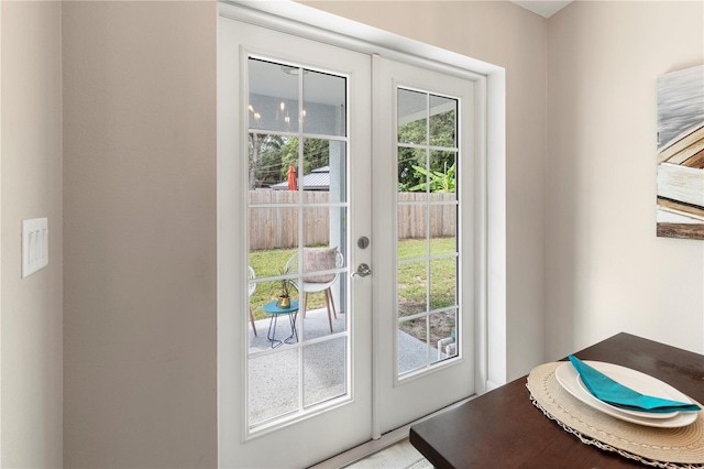 doorway to outside featuring french doors and plenty of natural light