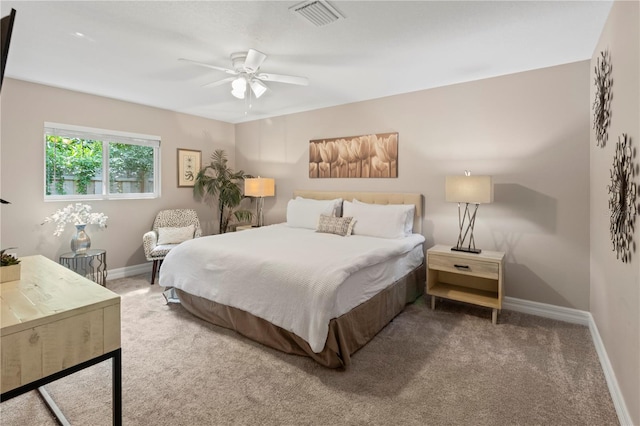 bedroom featuring ceiling fan and carpet