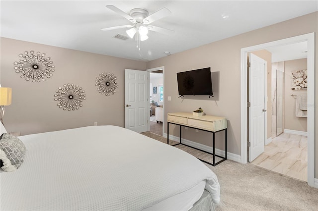 bedroom featuring light carpet and ceiling fan