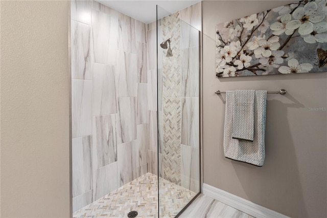 bathroom featuring tiled shower