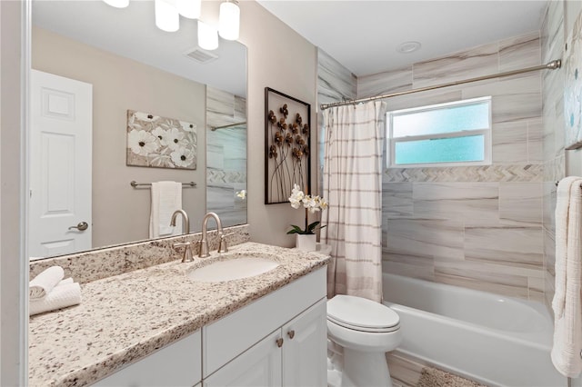 full bathroom with vanity, toilet, and shower / bath combo with shower curtain