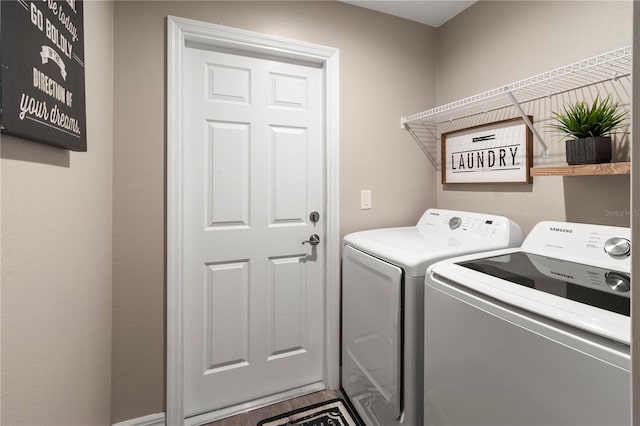 washroom featuring washer and dryer