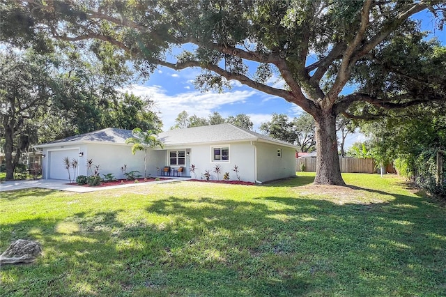 exterior space featuring a garage and a front lawn