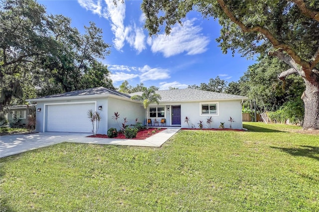 ranch-style home with a garage and a front lawn