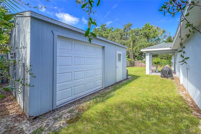 garage featuring a lawn