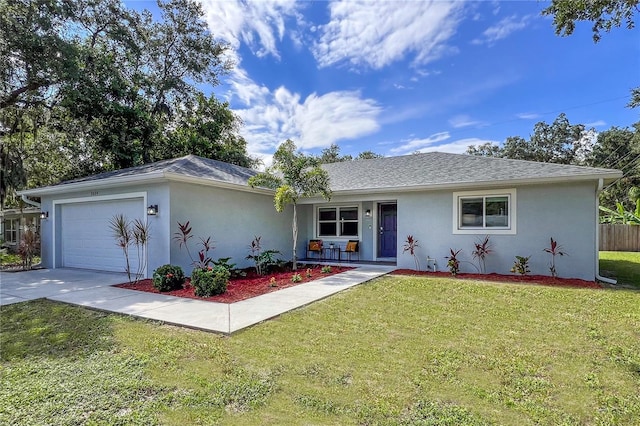 ranch-style house with a garage, a front yard, and covered porch