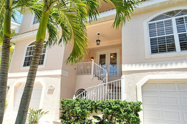 view of exterior entry featuring a garage