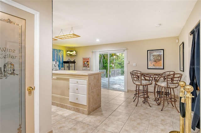 kitchen with light tile patterned flooring