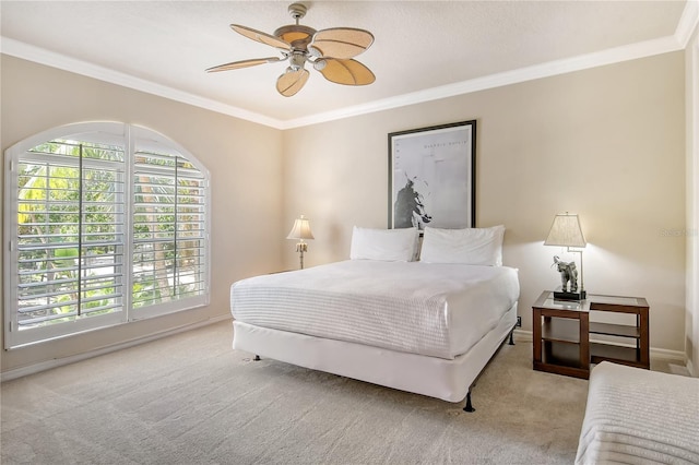 bedroom with ceiling fan, ornamental molding, and light colored carpet