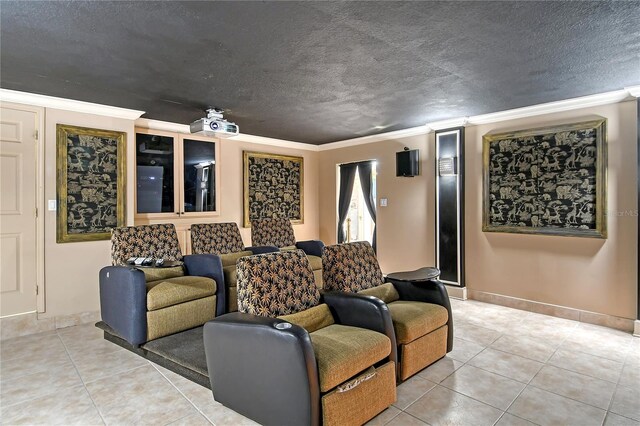 tiled home theater featuring a textured ceiling and ornamental molding