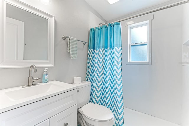 bathroom featuring a shower with curtain, vanity, and toilet