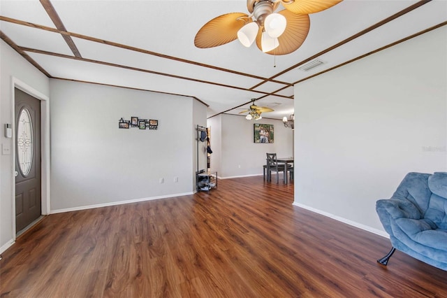 interior space featuring ceiling fan and dark hardwood / wood-style flooring