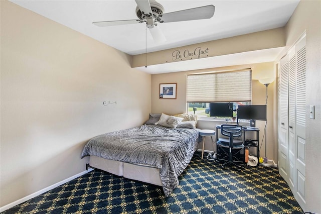 carpeted bedroom featuring a closet and ceiling fan