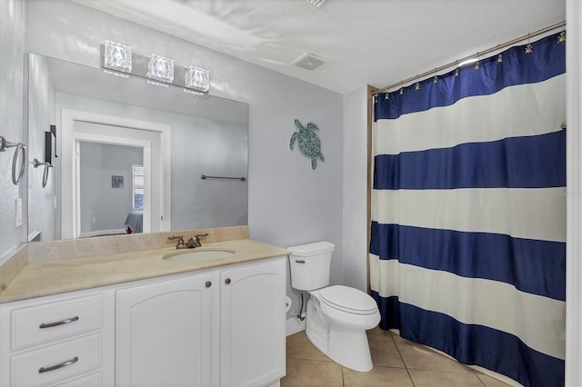 bathroom with visible vents, toilet, vanity, ensuite bath, and tile patterned flooring