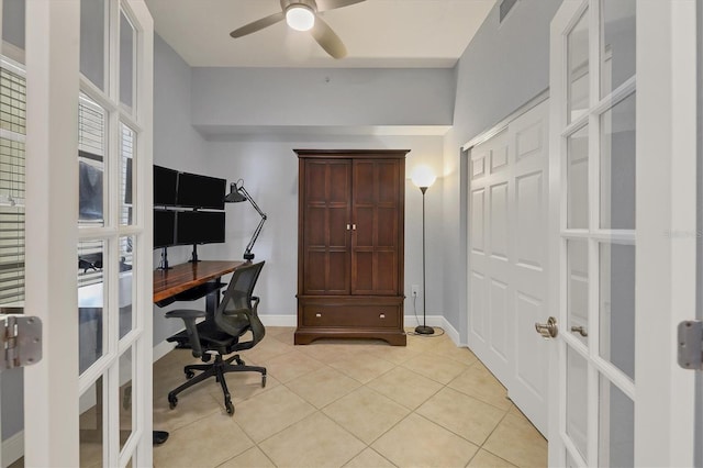 home office with french doors, visible vents, a ceiling fan, light tile patterned flooring, and baseboards