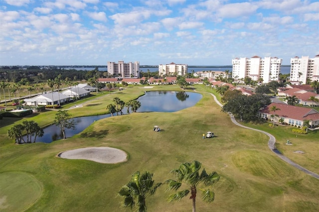 aerial view with a water view and view of golf course