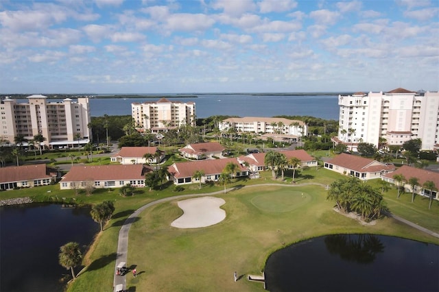 bird's eye view featuring golf course view and a water view