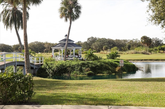 surrounding community featuring a water view, a yard, and a gazebo