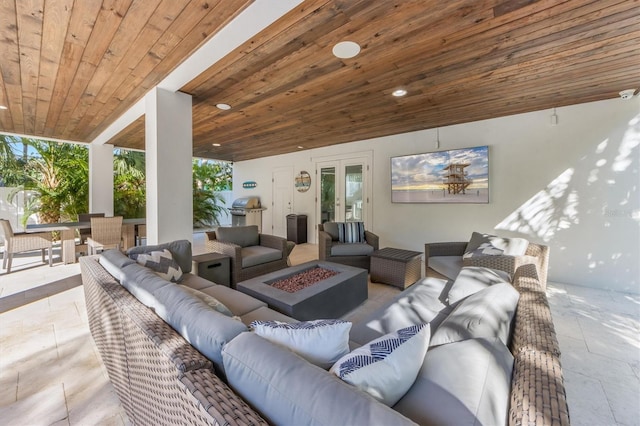 living room with wooden ceiling and light tile patterned flooring