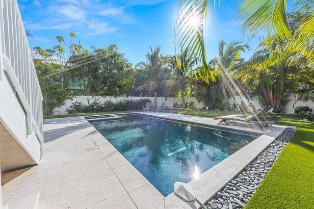 view of swimming pool featuring a patio area