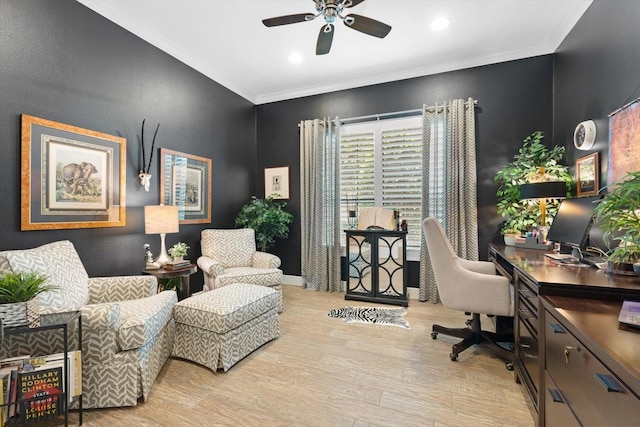 home office with ceiling fan, light hardwood / wood-style floors, and crown molding