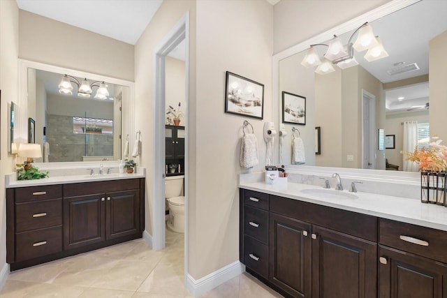 bathroom featuring vanity, toilet, walk in shower, and tile patterned floors