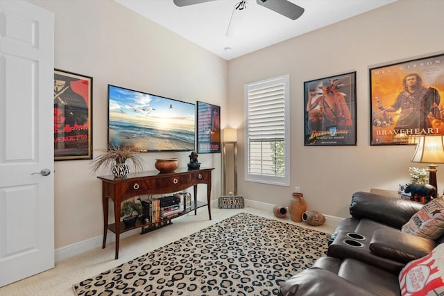 living room featuring light carpet and ceiling fan