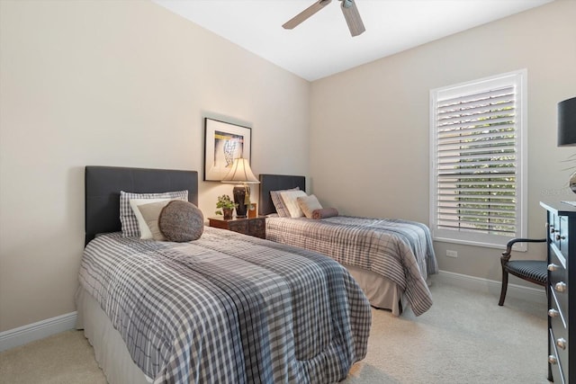 bedroom featuring ceiling fan and light carpet