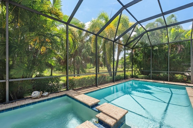 view of swimming pool with a lanai