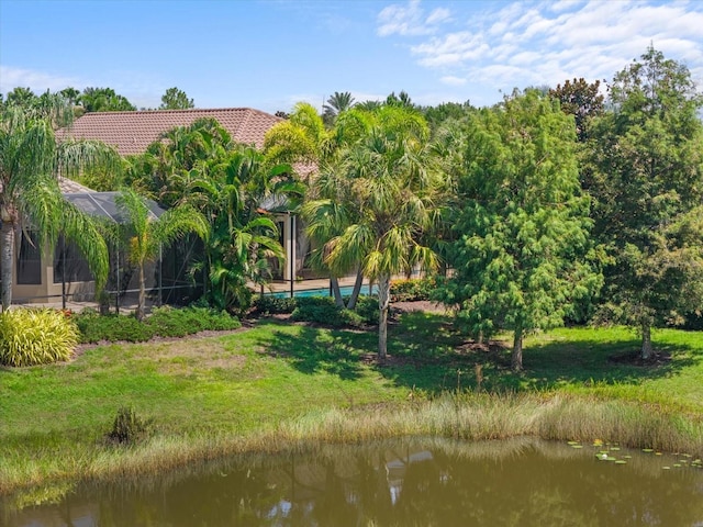 exterior space featuring a water view and a yard