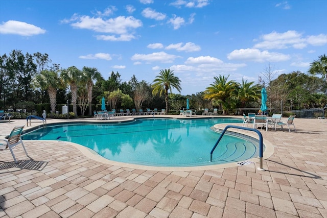 view of swimming pool featuring a patio area