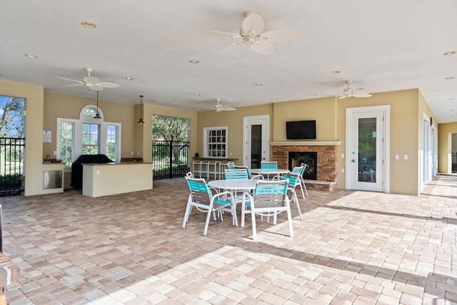 view of patio / terrace featuring ceiling fan and french doors