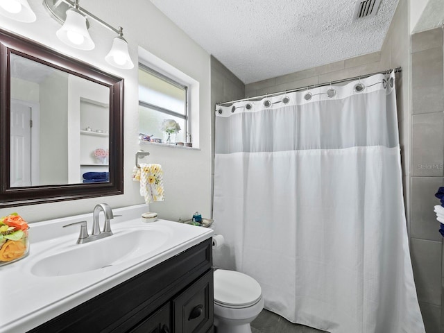 bathroom featuring a textured ceiling, toilet, a shower with shower curtain, vanity, and visible vents