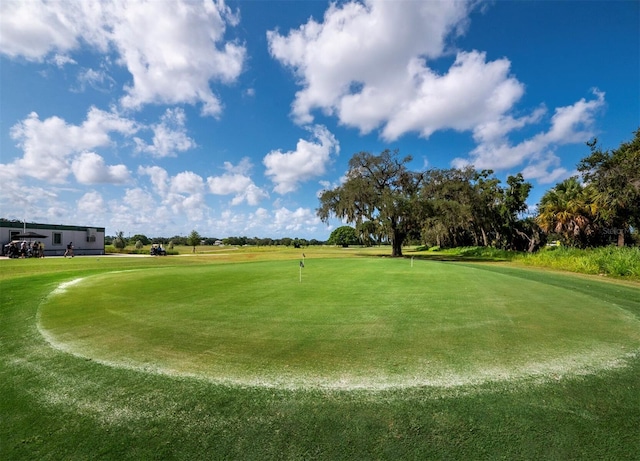 surrounding community featuring view of golf course