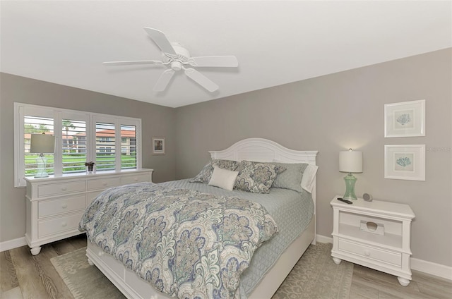 bedroom featuring ceiling fan and light hardwood / wood-style floors