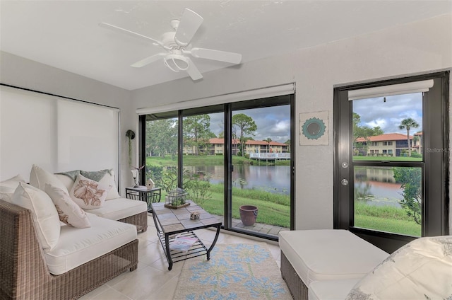 interior space featuring ceiling fan and a water view