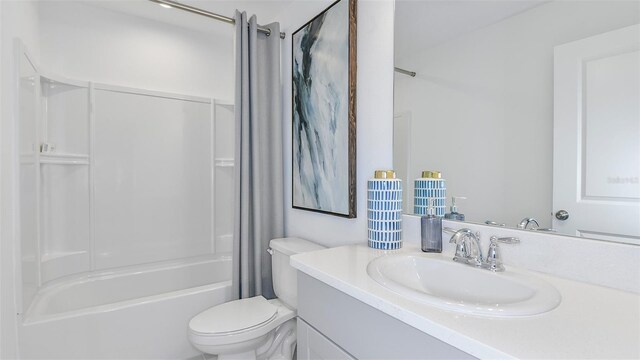 full bathroom featuring toilet, vanity, and shower / washtub combination