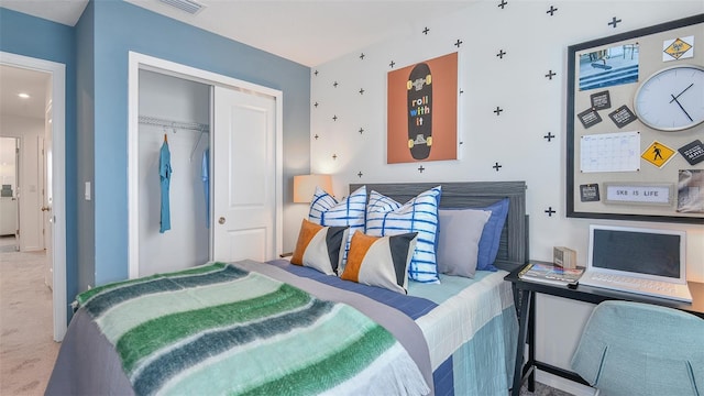 carpeted bedroom with a closet