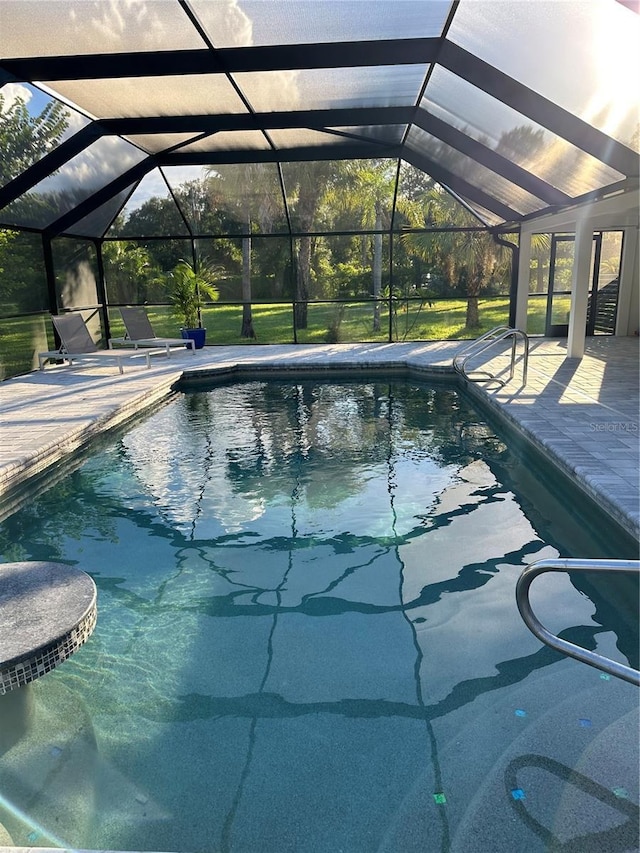 pool featuring a lanai and a patio area