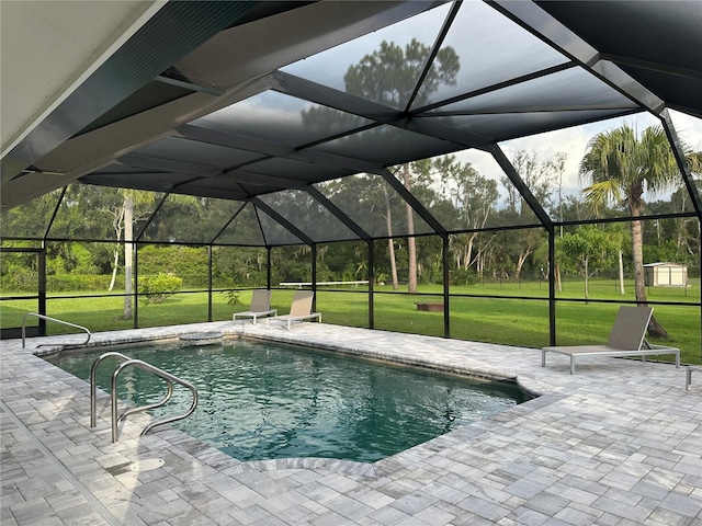 outdoor pool featuring glass enclosure, a patio, and a yard