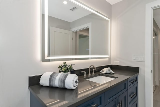 bathroom with vanity and visible vents