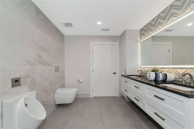 full bath featuring a sink, visible vents, and tile patterned flooring