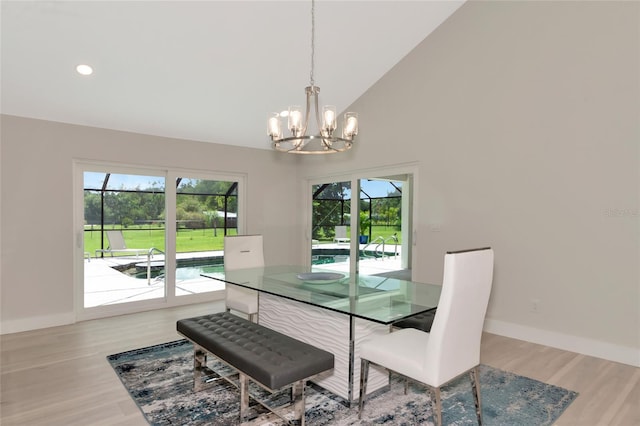 dining area featuring recessed lighting, plenty of natural light, baseboards, and light wood-type flooring